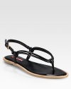 Flat leather design with knot details and an adjustable ankle strap. Leather upperLeather lining and solePadded insoleImportedOUR FIT MODEL RECOMMENDS ordering true size. 