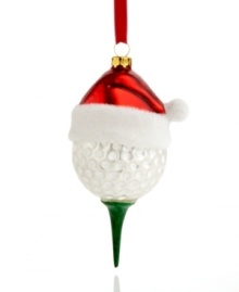 Christmas to a tee. Make your favorite golfer very merry with this molded glass golf ball ornament, topped in a red Santa hat.