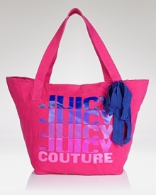 No Juicy girl's purse portfolio is complete without the label's signature canvas tote. Roomy and bright, this bag resounds with of-the-moment style, style, style. From Juicy Couture.