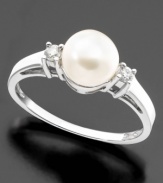 A fantastically beautiful cultured freshwater pearl (7mm) is the centerpiece of this blissful ring featuring round-cut diamonds (1/10 ct. t.w.) set in 14k white gold.