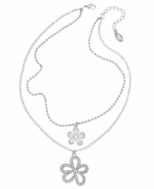 Embrace your feminine side with this dazzling floral design. GUESS's two-row necklace features two delightful flower charms accented by sparkling crystals. Set in silver tone mixed metal. Approximate length: 15 inches + 2-inch extender. Approximate drop: 2 inches.