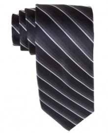 Stripes and a skinny style on this Bar III tie provide the perfect complement to any sleek day-to-night look.