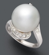 A timeless addition to your collection. This polished, versatile ring highlights a cultured South Sea pearl (13-14 mm) accented by sparkling round-cut diamonds (1/3 ct. t.w.). Set in 14k white gold.