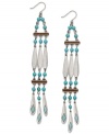 A tribal-inspired style guaranteed to turn a few heads. These worn silver tone earrings from Lauren by Ralph Lauren feature reconstituted turquoise beads and a chic linear drop design. Approximate drop: 5-1/2 inches.