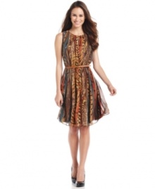 An animal-inspired mixed print and an earthy palette make this Calvin Klein dress a must-have. The feminine silhouette is accentuated with a coordinating belt.