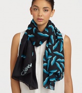 A smooth silk style that features a graphic, abstract lip print. SilkAbout 40 X 67Dry cleanImported 