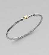 From the Cable Heart Collection. A thin signature cable band with a delicate 18K gold heart.Sterling silver 18K yellow gold Width, about 3mm Hook closure Imported 