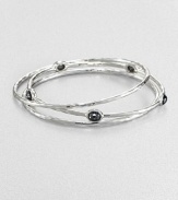 From the Rock Candy® Collection. A trio of hammered, sterling silver bangles accented with rich, faceted hematite. Sterling silverHematiteDiameter, about 2.5Slip-on styleImported 