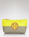 Tory Burch pops and blocks it with this top zip cosmetics case, accented by a bold logo and contrasting neon and neutral hues. It's a bold way to bag your beauty products.