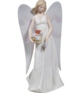 Stunningly crafted in smooth porcelain, this lovely angel from Lladro stands tall atop your tree to shower your home with peace and goodwill.