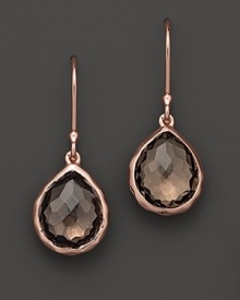 Faceted smokey quartz reflects light on a polished pair of rosegold Ippolita earrings.