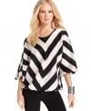 A striking V-shaped stripe and billowy sleeves punctuate Vince Camuto's latest blouse.