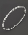 Simply chic--single or stacked. Faceted diamonds set in gleaming 18K white gold. By Roberto Coin.