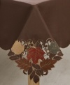 Featuring elaborate cutwork, embroidered accents and leaves piled in rich fall colors, the Maple Leaf round tablecloth sets the scene for an unforgettable autumn, year after year.