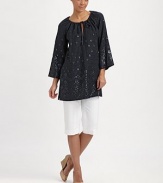 An enticing tunic with spectacular beading, a flattering fit and convenient slash pockets. Round neckSelf-tieThree-quarter sleevesSlash pocketsPull-on styleAbout 32 from shoulder to hemLinenDry cleanImported