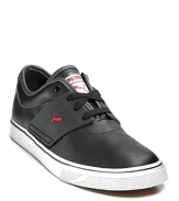 Lace up sneaker with perforated detail all over. Embossed logo on the side. Black on black with red accents. Durable rubber sole.