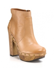 Gleaming studs anchor luxe leather to natural wood for a '70s-inspired clog boot with very modern appeal. By Lucky Brand.