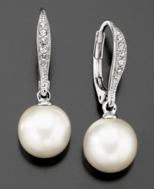 Glistening with glamour, these beautiful Eliot Danori earrings feature glass pearls (10 mm) and crystal accents set in silvertone rhodium-plated mixed metal. Approximate drop: 1 inch.