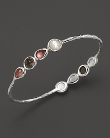 Faceted doublets of clear quartz, almond, smoky quartz and mother-of-pearl in a sterling silver bangle. By Ippolita.