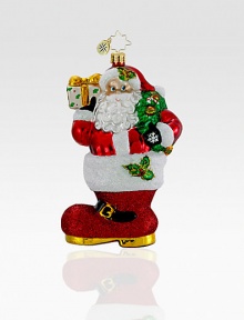 Hand-painted and glitter-dusted, an artfully crafted Santa of European glass rests inside an oversized boot. Hand-blownHand-painted5½ tallMade in Poland