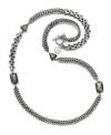 Let long luxurious links unfurl around your neckline. This latest long necklace from the Jessica Simpson collection features four smoke-colored crystal stone accents set in silver tone mixed metal. Approximate length: 36 inches.