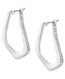 Abstract elegance. This pair of oval hoop earrings from Robert Lee Morris is crafted from silver-tone mixed metal with glass pave crystal accents providing a lustrous touch. The sculptural shape enhances the appeal. Approximate drop: 1-1/4 inches. Approximate diameter: 1/2 inch.