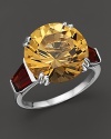 Tapered garnet baguettes create a warm glow around a 6.03 ct. t.w. citrine set in 18K white gold.