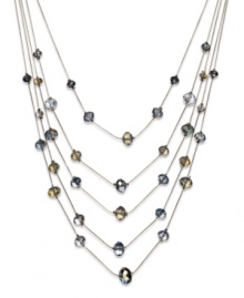 Find a sophisticated new level of style. This five-row illusion necklace by c.A.K.e by Ali Khan boasts opal-colored glass beads (10-12 mm). Set in gold tone mixed metal. Approximate length: 17 inches + 3-inch extender. Approximate drop: 6 inches.