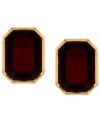 Red and gold lend a look of vibrant elegance. These stud earrings from Anne Klein features faceted red stones in a golden setting. Crafted in gold tone mixed metal. Approximate diameter: 1/2 inch.