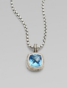 From the Albion Collection. A beautiful faceted blue topaz center stone surrounded by dazzling diamonds. Diamonds, .3 tcw Blue topaz Sterling silver Size, about ½L X ½ W Imported Please note: Chain sold separately. 