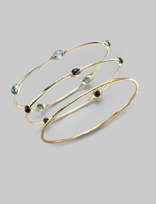 Five faceted blue topaz stones are sprinkled along a slender bangle of 18k gold. Blue topaz 18k yellow gold Diameter, about 2¾ Imported Please note: Bracelets sold separately.