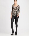 When looking for a top to accentuate your curves and stop traffic, there's no need to look further than this leopard-print design.ScoopneckElbow-length sleevesBody-conscious fitAllover printPull-on styleAbout 27 from shoulder to hemViscoseDry cleanImported Model shown is 5'11 (180cm) wearing US size Small. 