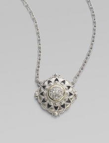 From the Windsor Collection. A lacy medallion combining graphic shapes, delicate granulation and the sparkle of white sapphires hangs from a graceful chain of textured links. White sapphires Sterling silver and 18k yellow gold Chain length, about 17 Pendant diameter, about 1 Lobster clasp Imported