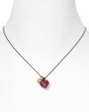 Make Juicy Couture's vibrant pavé heart necklace your go-to piece for playful glamour.