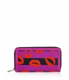 Detailed with a mash-up of bold graphic prints, Marc by Marc Jacobs stripey lips wallet is a fun choice for stashing away your everyday essentials - Metal zip-around closure, zippered change purse, multiple credit card slots, leather trim - Carry alone for running quick errands, or slip into a bright monochrome handbag