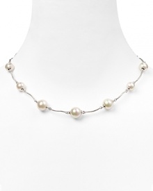 Luminous and versatile. Pearls are always a classic, and this curved link necklace from Majorica is a delicate way to wear them.