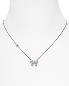 Tie on sweet sparkle with this delicate crystal bow necklace from Juicy Couture, sure to be on every girl's wish list.