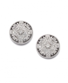 Poise and polish. These elegant stud earrings by Eliot Danori add a regal touch to your look. Crafted in silver tone mixed metal with a scroll pattern and sparkling crystal accents. Approximate diameter: 1/2 inch.