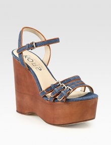 Skinny, adjustable straps in dazzling denim with leather trim and a towering wooden wedge. Wooden wedge, 5 (125mm)Wooden platform, 2 (50mm)Compares to a 3 heel (75mm)Denim and leather upperLeather lining and solePadded insoleImported