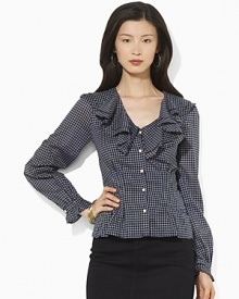 A flourish of ruffles and a peplum hem add feminine allure to a soft woven cotton blouse, finished in a heritage checked pattern.