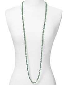 Simple and versatile. This extra-long beaded strand from Carolee adds a dash of color to your neckline, crafted of adventurine stones.