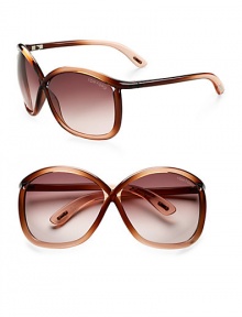 Modern oversized cat eye shaped frames with iconic Tom Ford floating lens and tubular acetate temple. Available in gradient brown/light orange with gradient brown/rose lens.Acetate 100% UV protection Made in Italy 