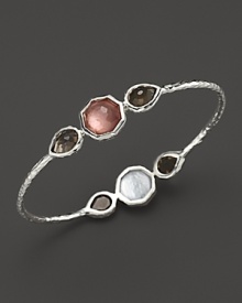 Faceted doublets of clear quartz, almond and mother-of-pearl in a sterling silver bangle. By Ipploita.