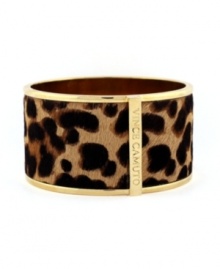 Feline ferocity. Vince Camuto's wild style features a chic cuff bracelet wrapped with a leopard print pony skin surface. Crafted in gold tone mixed metal. Approximate diameter: 2 inches.