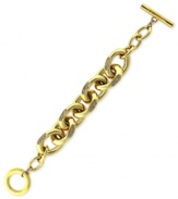 Bold and beautiful. This chain bracelet from Vince Camuto is crafted from gold-tone mixed metal, with glass crystal pave accents adding a lustrous touch. Approximate length: 8 inches.