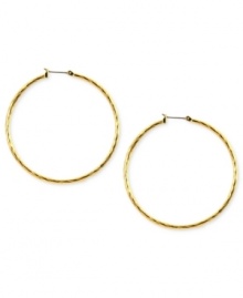 Embellished elegance. Anne Klein adds glass accents to these hoop earrings crafted from gold-tone mixed metal to stunning effect. Approximate diameter: 2 inches.