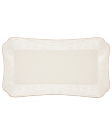 With fanciful beading and a feminine edge, the hors d''oeuvre tray from the Lenox French Perle dinnerware collection has an irresistibly old-fashioned sensibility. Hard-wearing stoneware is dishwasher safe and, in a soft white hue with antiqued trim, a graceful addition to any meal. Qualifies for Rebate