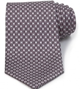 A luxurious piece that lies at the center of your dress wardrobe, this handsome tie from Salvatore Ferragamo is crafted in 100% Italian silk.