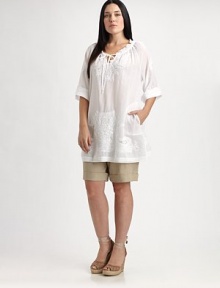 Thanks to its chic, roll-tab sleeves and relaxed fit, this cotton design offers a flattering, ultra-feminine fit. Plus, you will not be able to resist its gorgeous embroidery.Self-tie detail at ruched necklineRoll-tab sleevesLovely embellished detailsPull-on styleAbout 34 from shoulder to hemCottonDry cleanImported