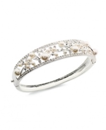 The hinged design stands out as a unique feature on Charter Club's chic bangle bracelet. Crafted in silver tone mixed metal, it's elaborately embellished with simulated pearls and glass accents. Approximate diameter: 2-1/4 inches.